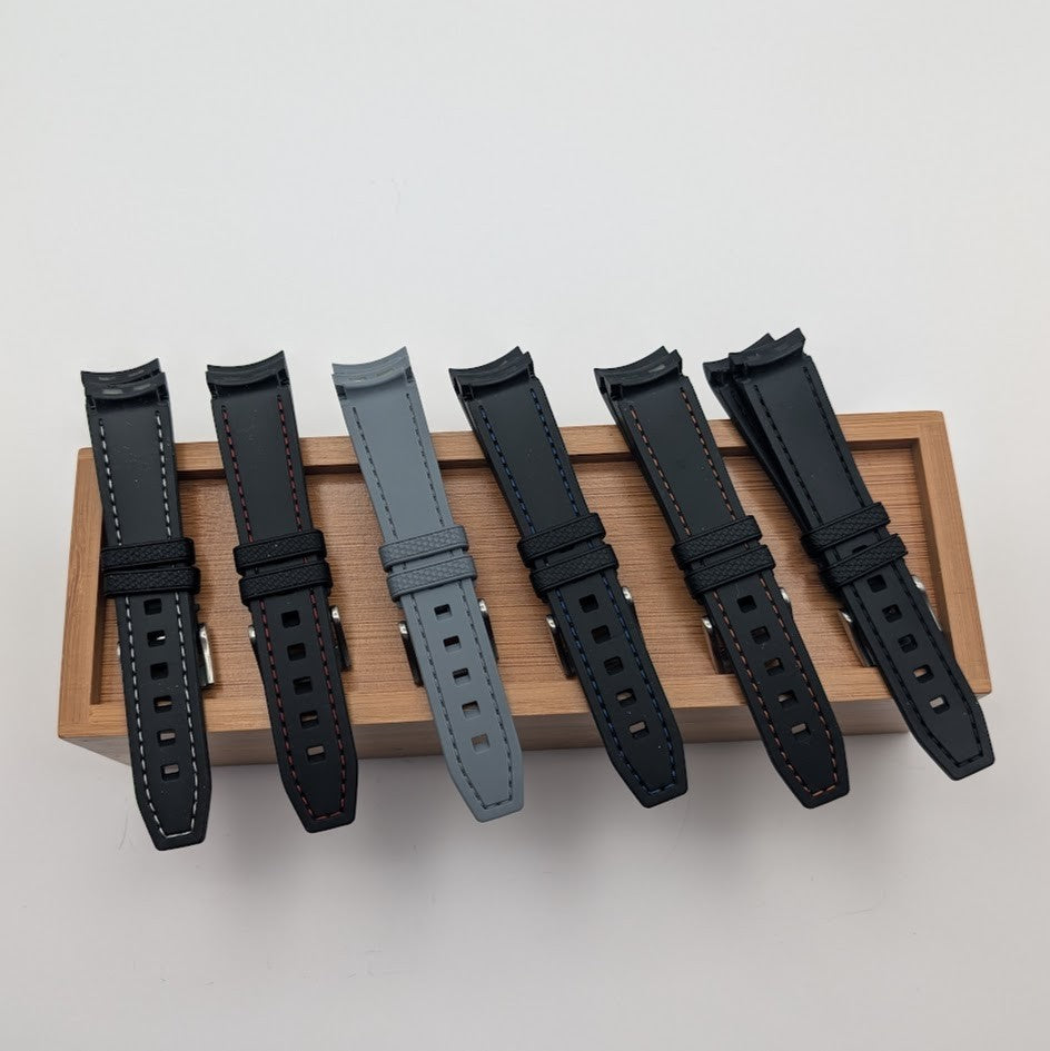 Set of five watch straps on a wooden stand with a light gray background