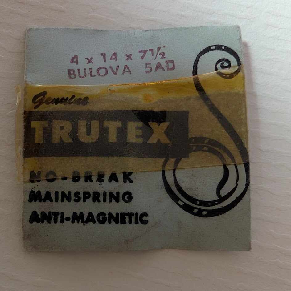Trutex no-break mainspring packaging on a light wooden surface