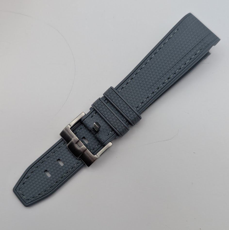 Gray textured watch strap with silver buckle on a light gray background