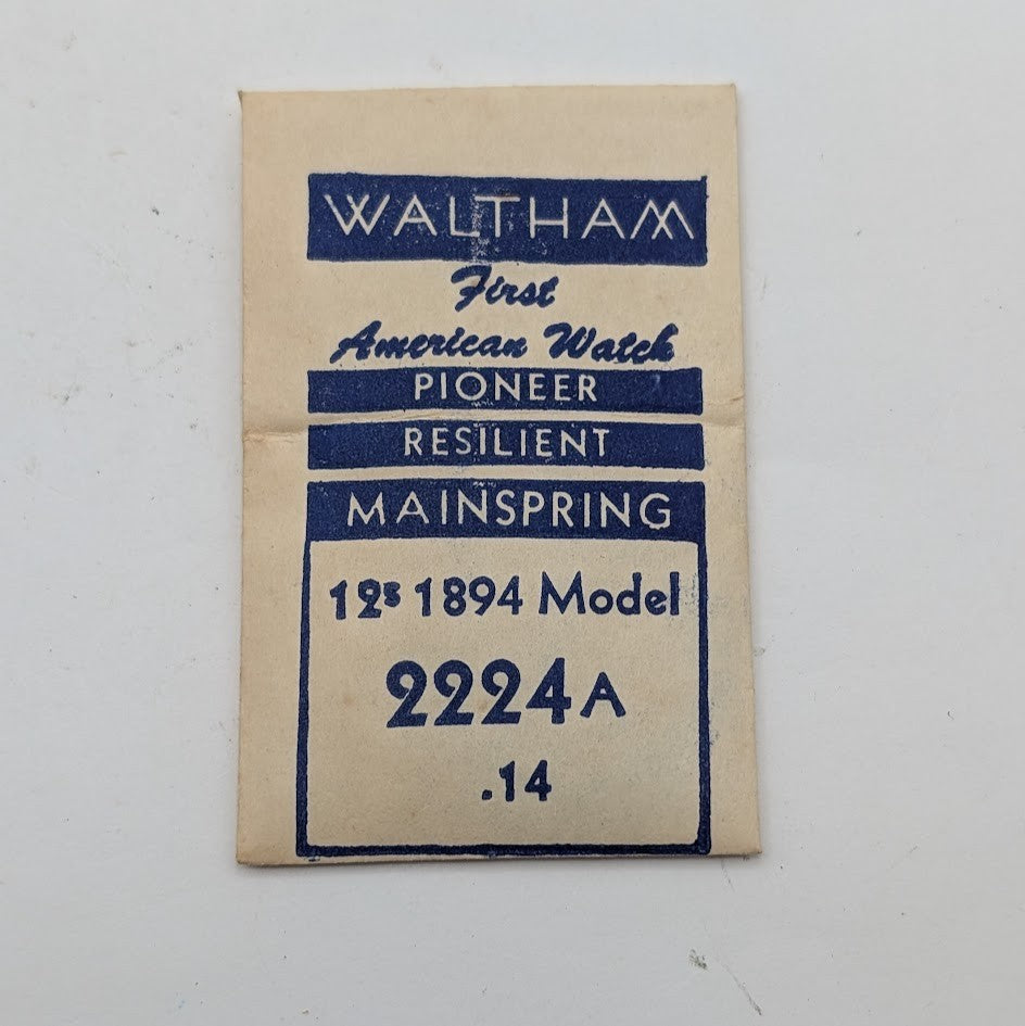 Waltham watch mainspring packaging with blue text on a beige background