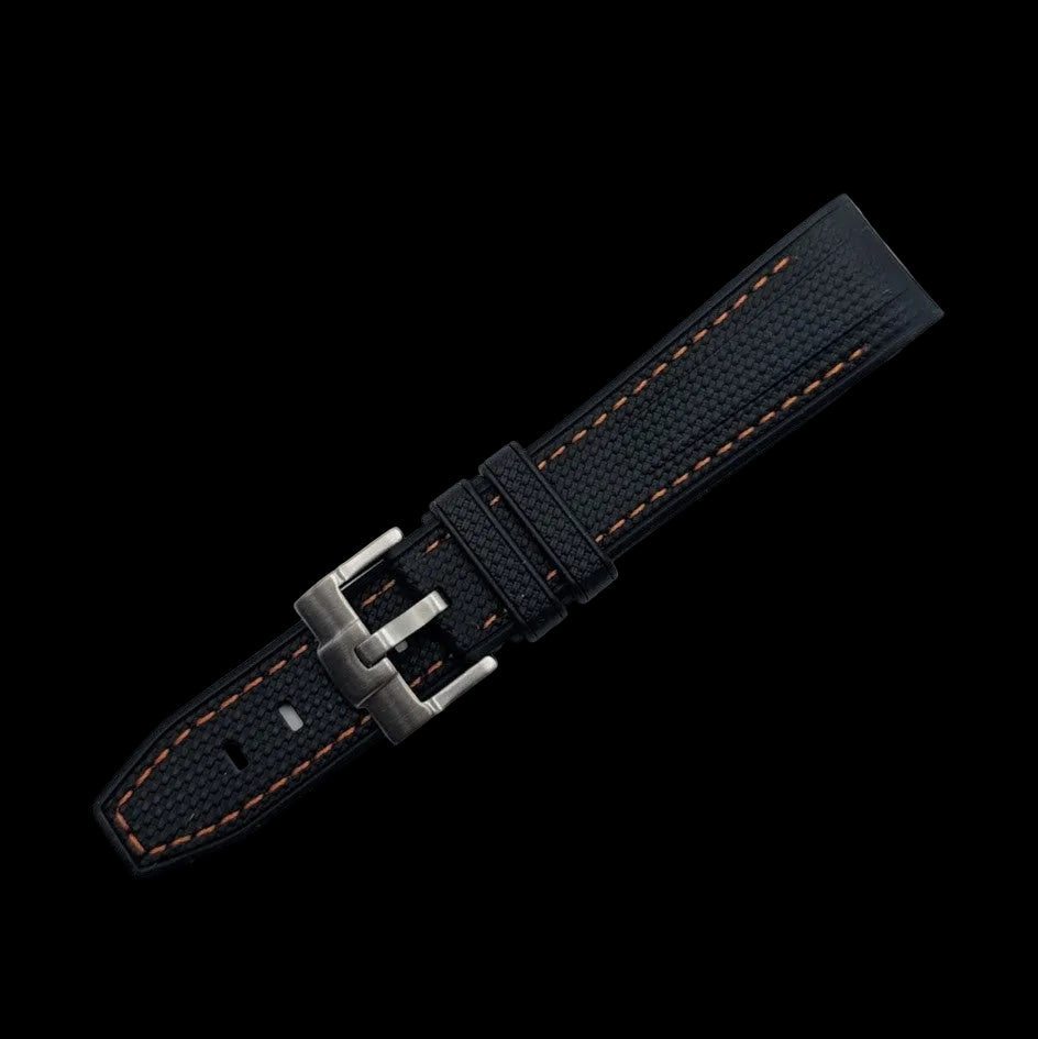 Black watch strap with orange stitching on a dark gray background